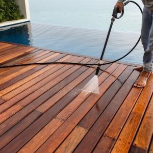 thai-man-pressure-washing-timber_30478-3613